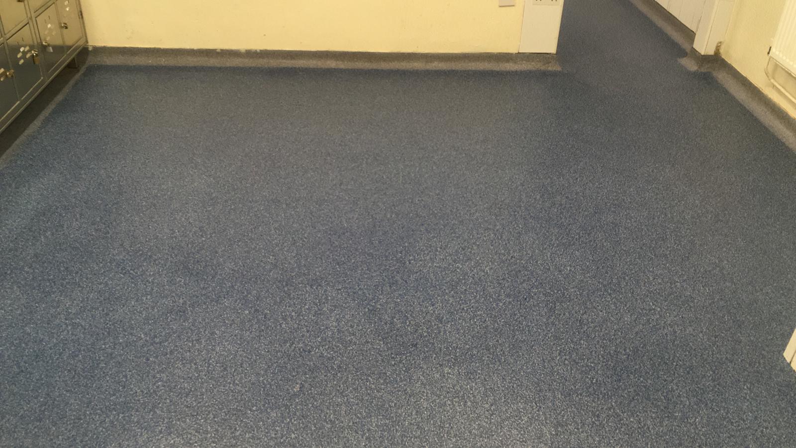 Blue speckled resin floor in a production area