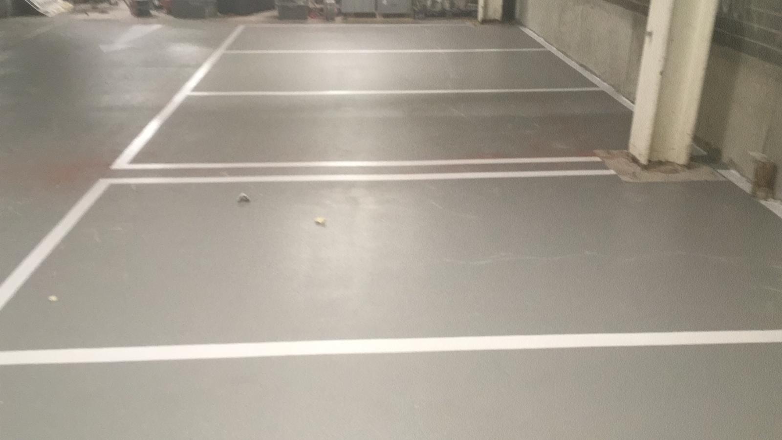 Grey resin warehouse floor with white line markings