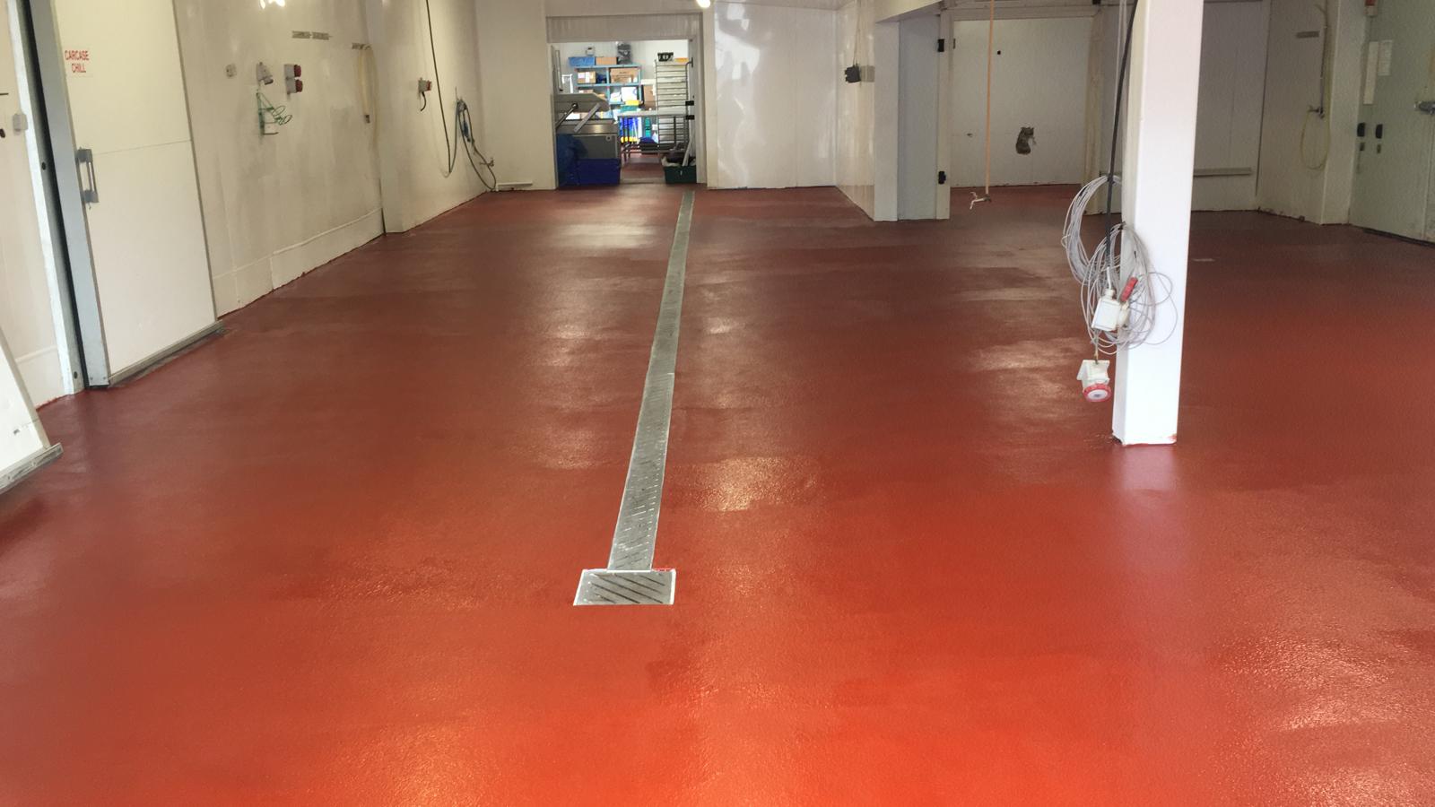 Red resin floor with stainless steel drainage channel