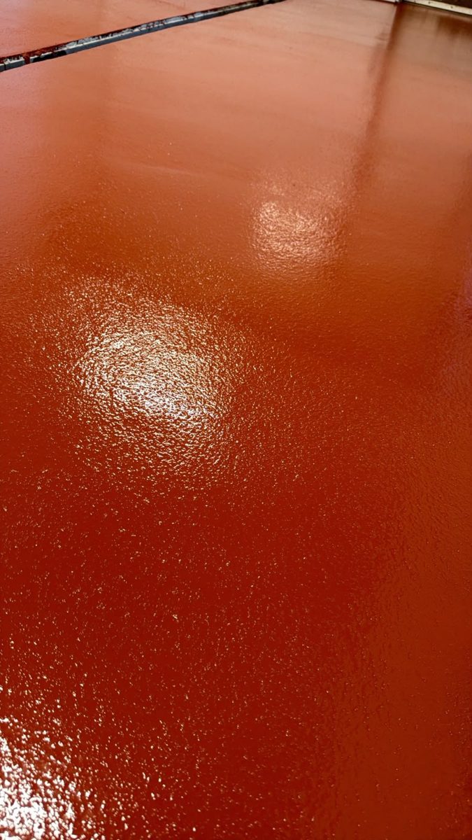Red anti-slip resin floor with a high-gloss finish